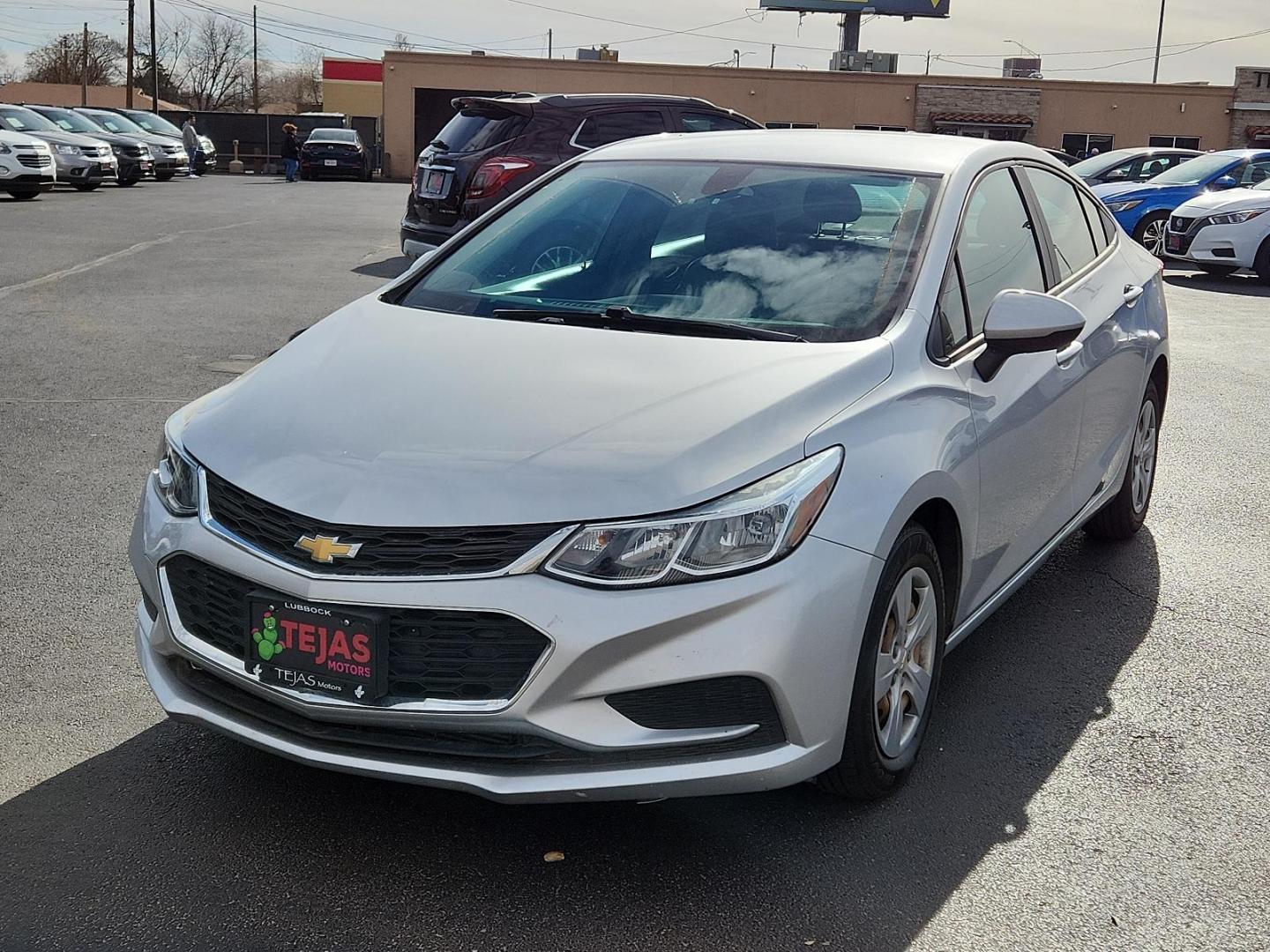 2017 Silver Ice Metallic - GAN Chevrolet Cruze LS (1G1BC5SM5H7) with an ENGINE, 1.4L TURBO DOHC 4-CYLINDER DI engine, located at 4110 Avenue Q, Lubbock, 79412, 33.556553, -101.855820 - Photo#1