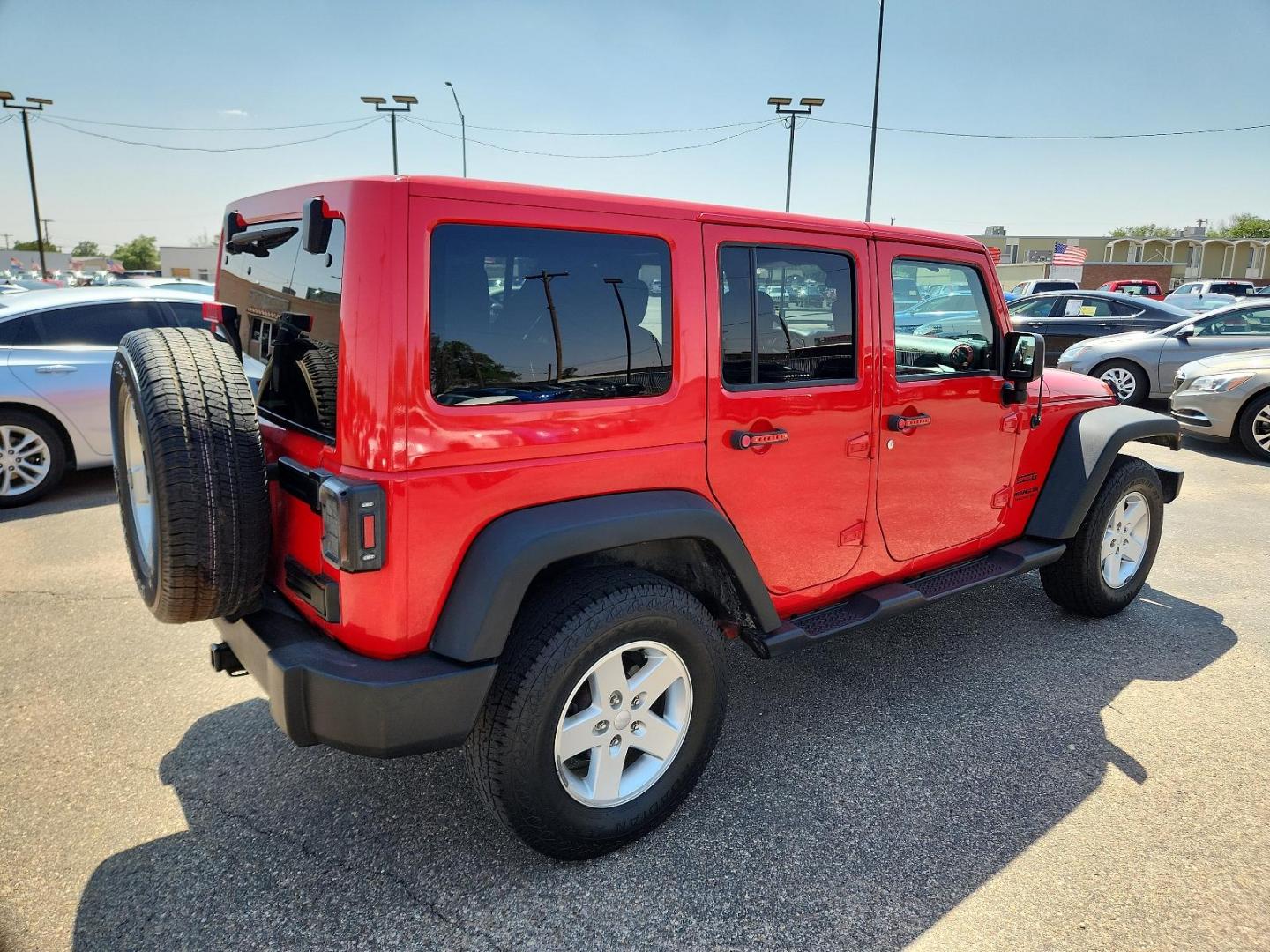 2016 RED Jeep Wrangler Unlimited Sport (1C4BJWDG3GL) with an ENGINE: 3.6L V6 24V VVT engine, located at 4110 Avenue Q, Lubbock, 79412, 33.556553, -101.855820 - Photo#1