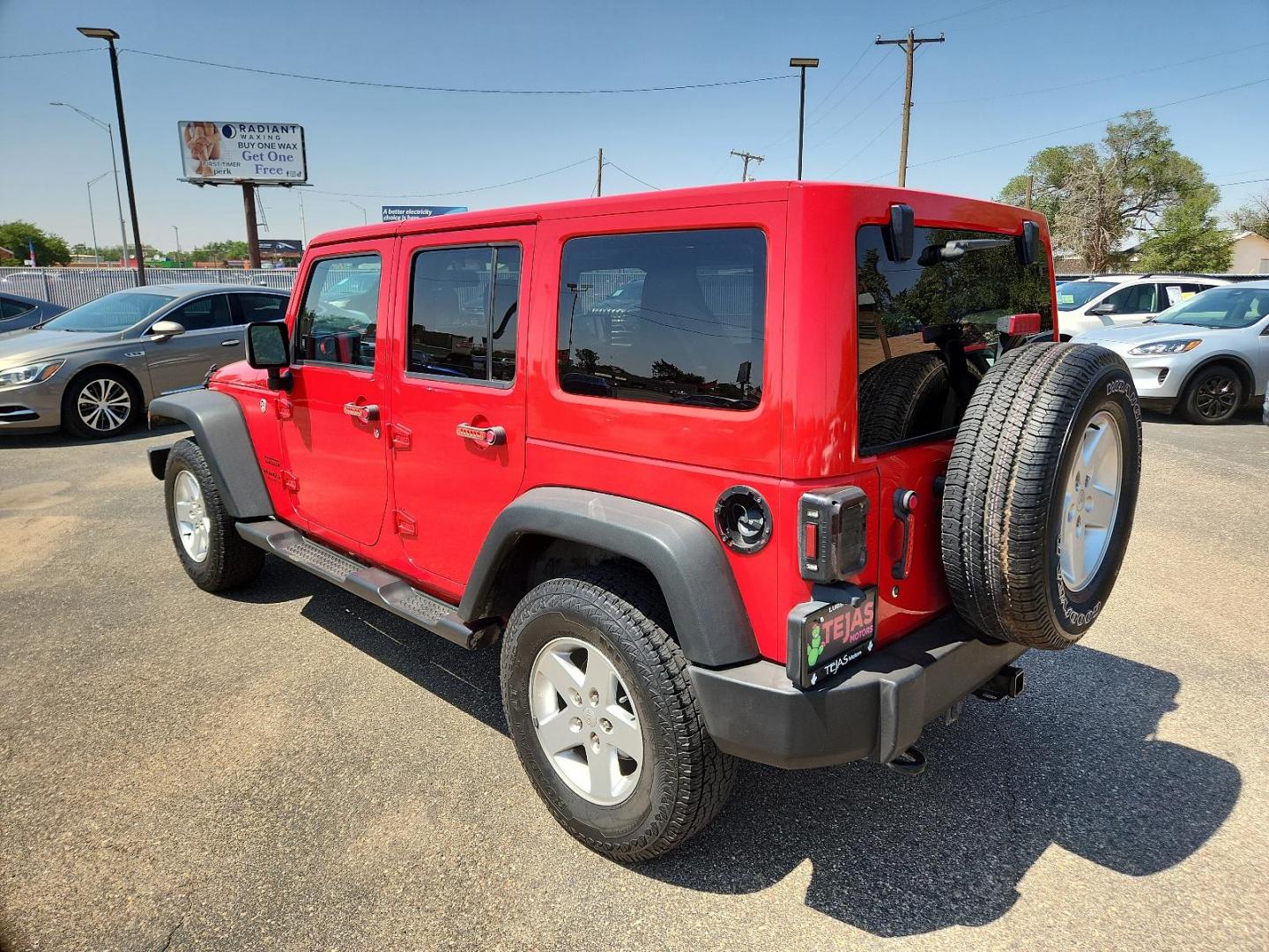 2016 RED Jeep Wrangler Unlimited Sport (1C4BJWDG3GL) with an ENGINE: 3.6L V6 24V VVT engine, located at 4110 Avenue Q, Lubbock, 79412, 33.556553, -101.855820 - Photo#2