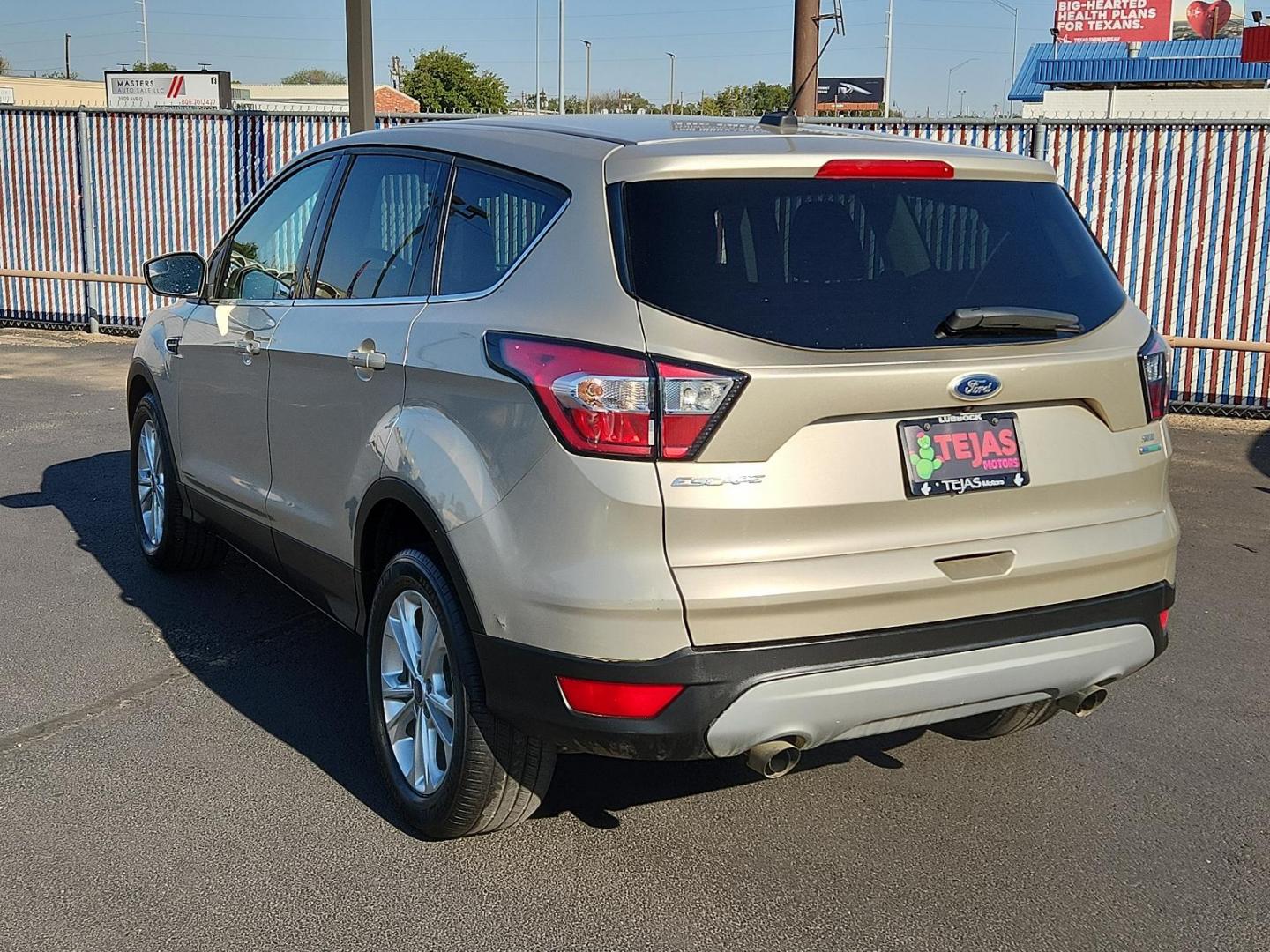 2017 GOLD Ford Escape SE (1FMCU0GD2HU) with an ENGINE: 1.5L ECOBOOST engine, located at 4110 Avenue Q, Lubbock, 79412, 33.556553, -101.855820 - 10/04/2024INSPECTION IN ENVELOPE GOD 10/08/2024 KEY IN ENVELOPE GOD - Photo#2